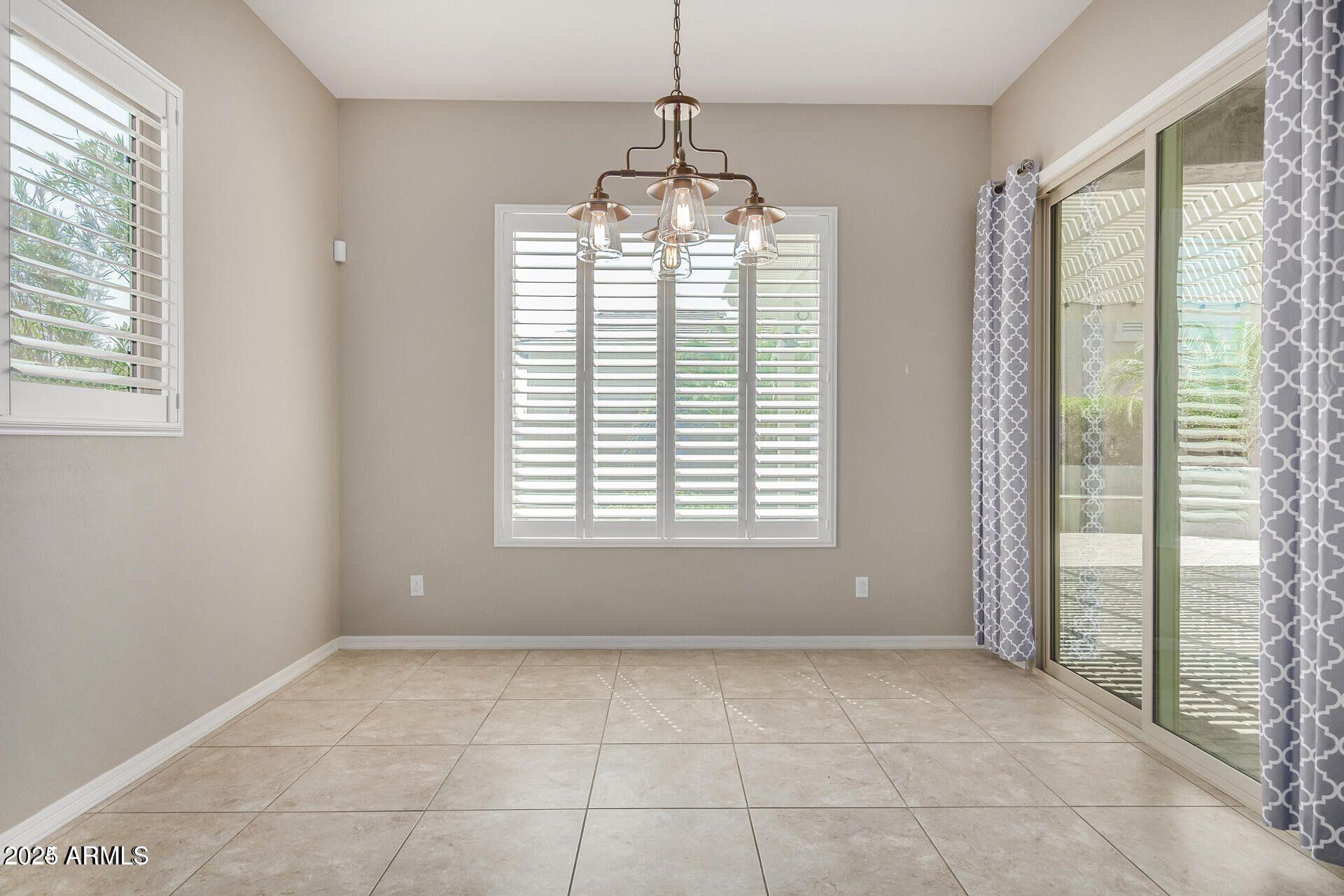 15430 South 183rd Lane Goodyear, AZ 85338 - Photo 16 of 66 a view of an empty room with a window