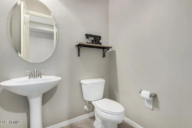 an empty room with closet and chandelier fan