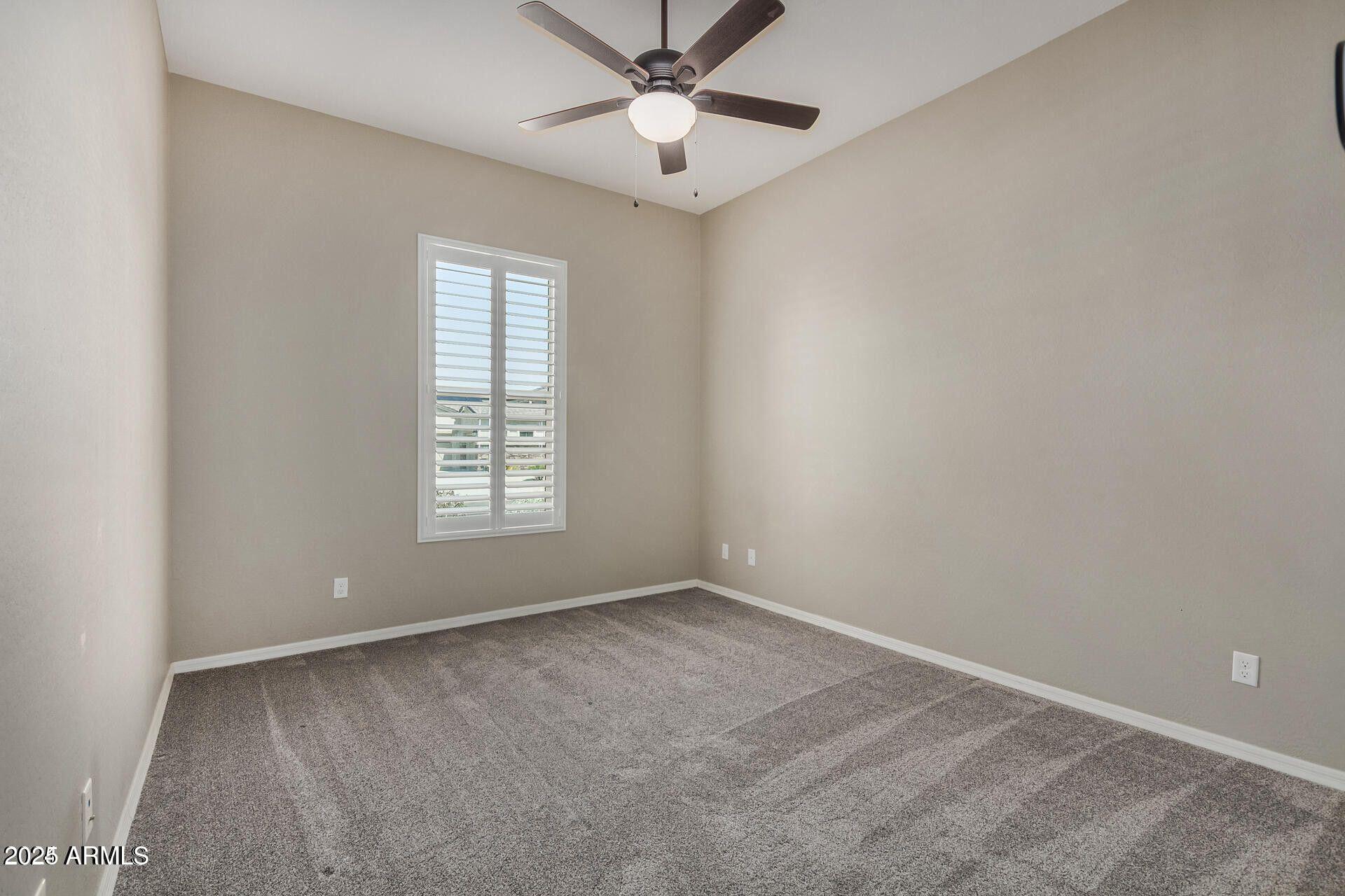 15430 South 183rd Lane Goodyear, AZ 85338 - Photo 26 of 66 a view of an empty room with a window