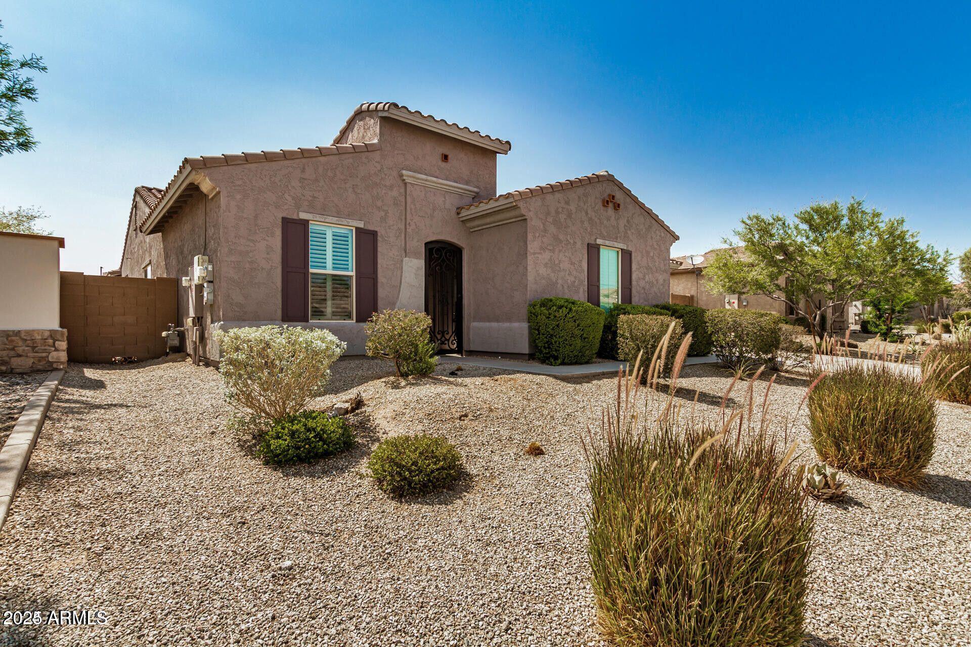 15430 South 183rd Lane Goodyear, AZ 85338 - Photo 3 of 66 a front view of a house with garden