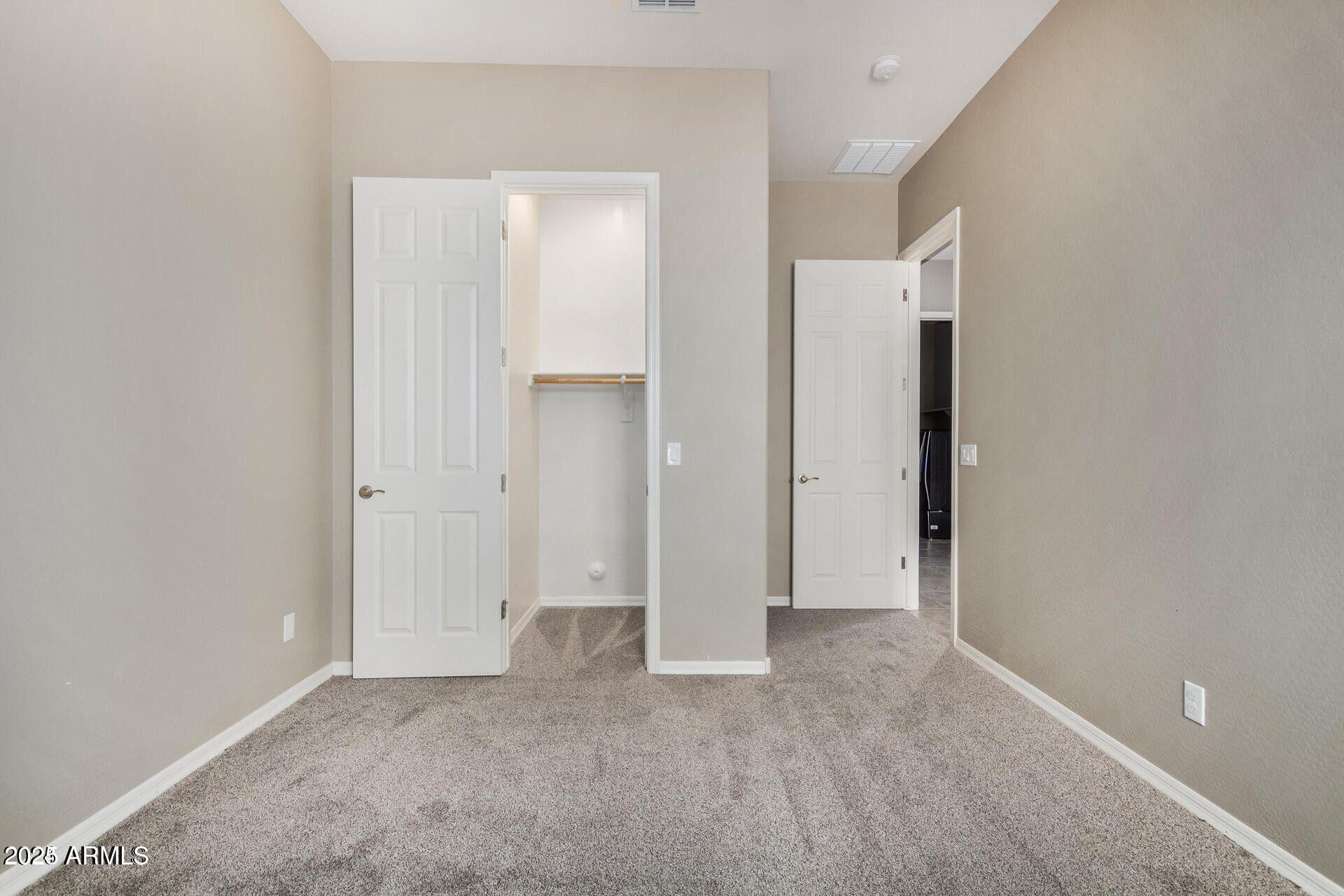 15430 South 183rd Lane Goodyear, AZ 85338 - Photo 32 of 66 an empty room with closet area