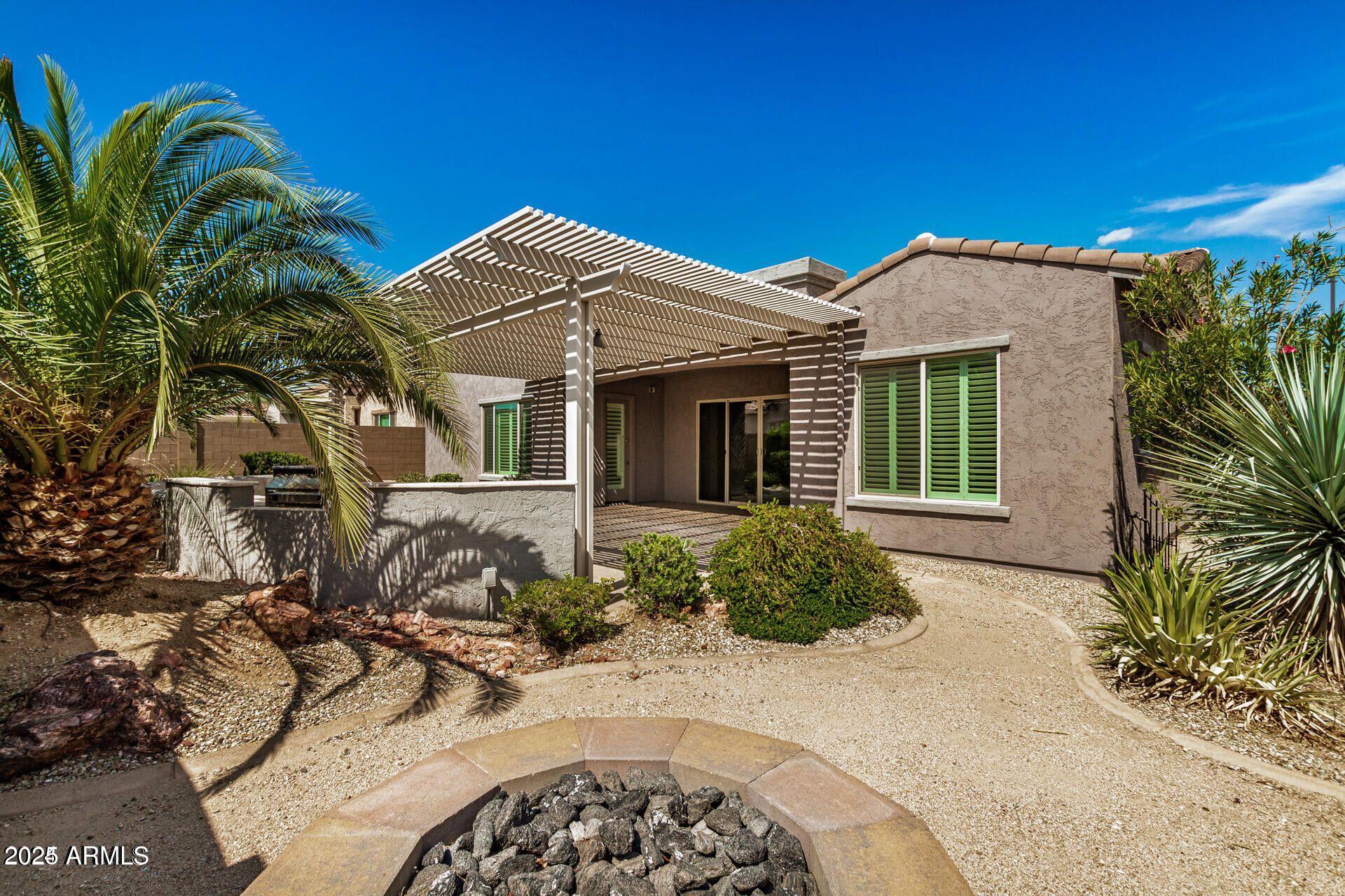 15430 South 183rd Lane Goodyear, AZ 85338 - Photo 36 of 66 a front view of a house with a yard