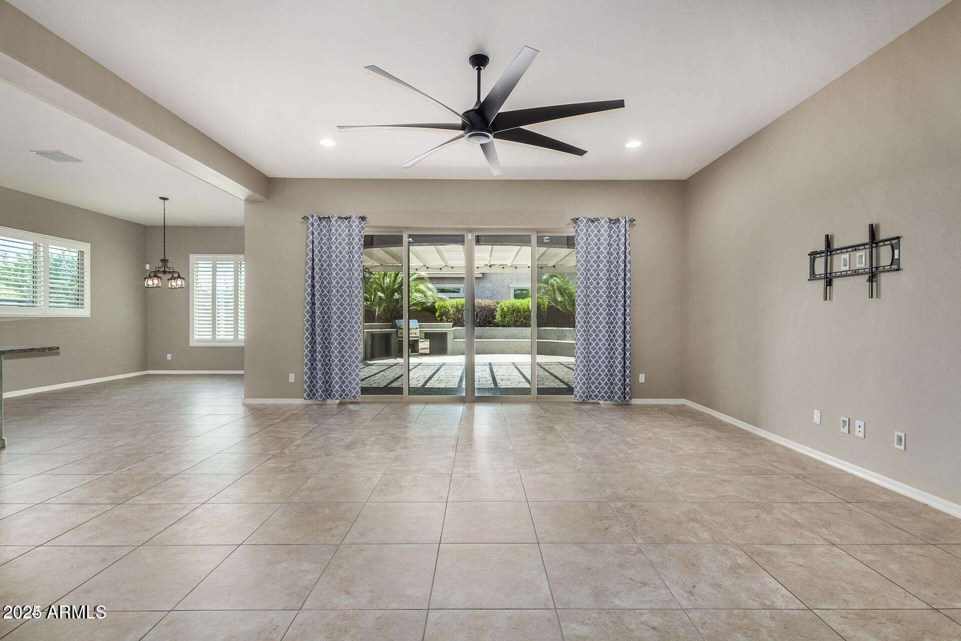 15430 South 183rd Lane Goodyear, AZ 85338 - Photo 10 of 66 a view of an empty room with a window