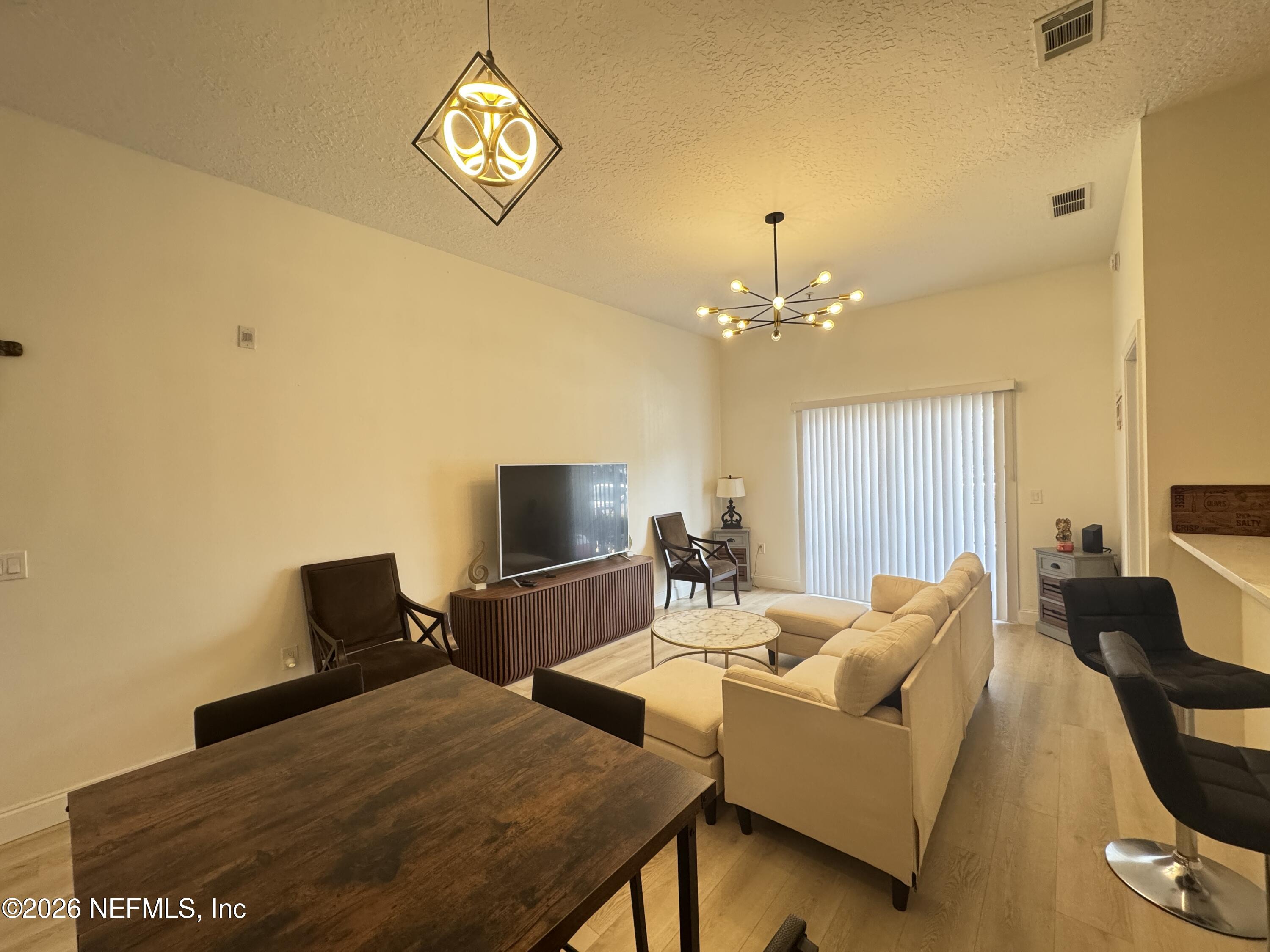 7920 Merrill Road, Unit 1205 Jacksonville, FL 32277 - Photo 11 of 25 Living Room