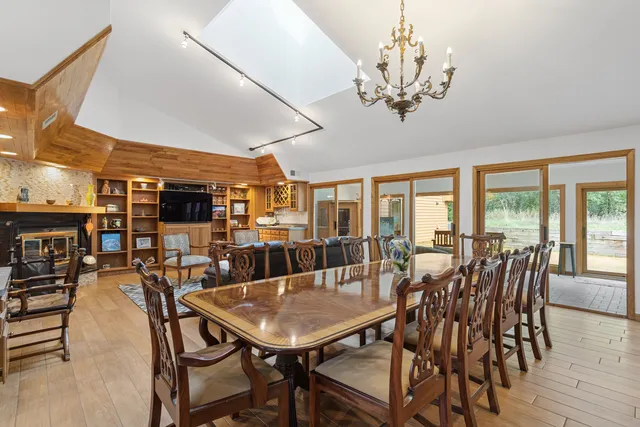 a living room with fireplace furniture and a window
