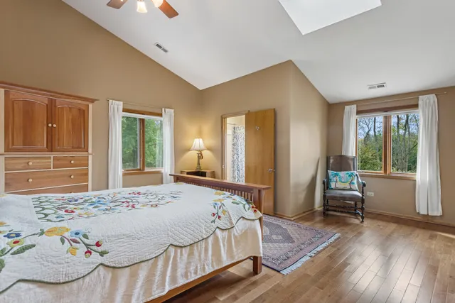 a kitchen with a sink cabinets and wooden floor