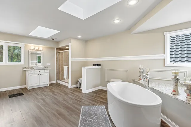 a living room with furniture and large windows