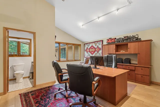 a living room with furniture and a floor to ceiling window