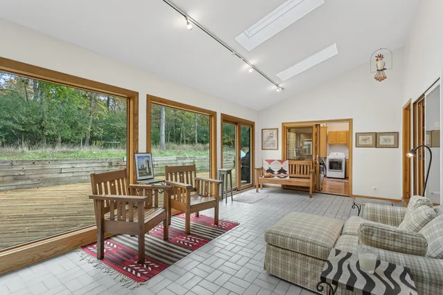 a kitchen with stainless steel appliances granite countertop a sink a stove and a microwave