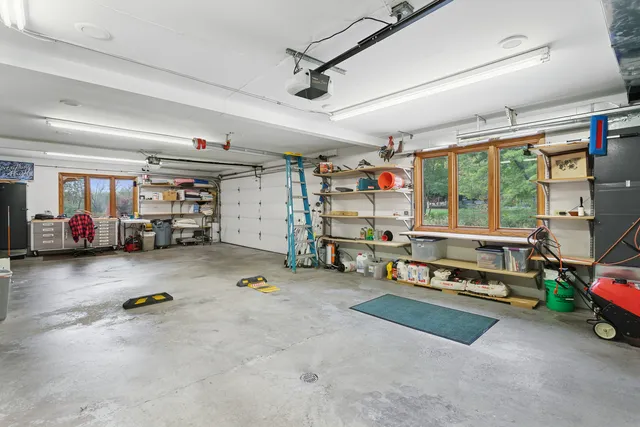an aerial view of house with yard and lake view