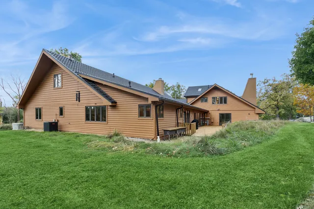 a bathroom with a glass door shower and a sink