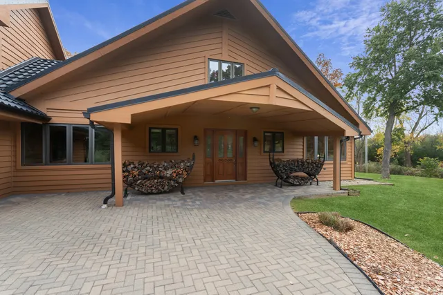 a kitchen with stainless steel appliances granite countertop a stove and wooden cabinets