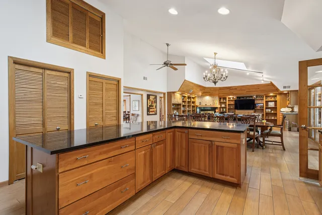 a dining room with furniture window and wooden floor