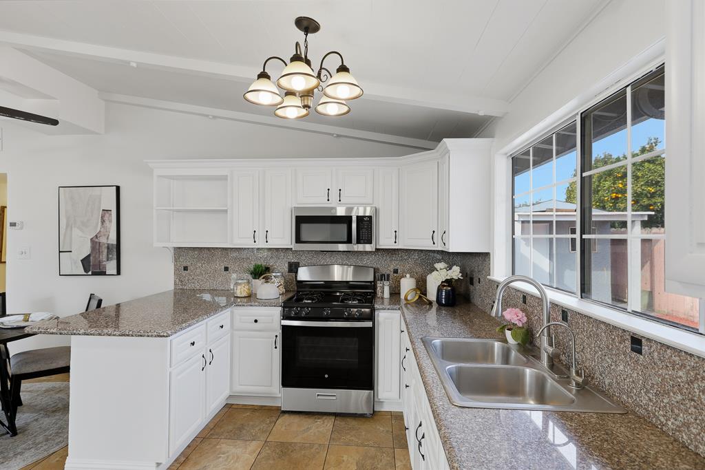 2675 Leeward Street Hayward, CA 94545 - Photo 17 of 75 a kitchen with a sink cabinets and window