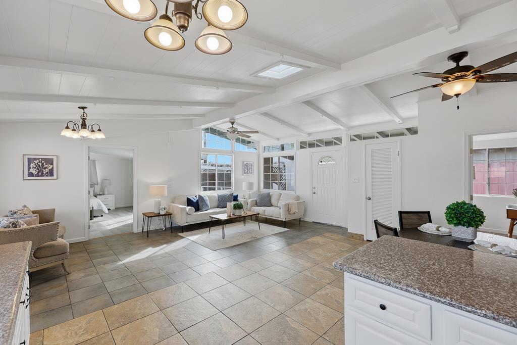 2675 Leeward Street Hayward, CA 94545 - Photo 19 of 75 a living room with granite countertop furniture and a chandelier