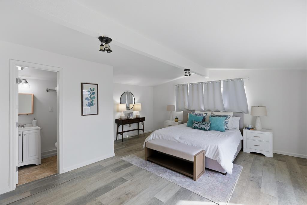 2675 Leeward Street Hayward, CA 94545 - Photo 24 of 75 a bedroom with a bed and a table