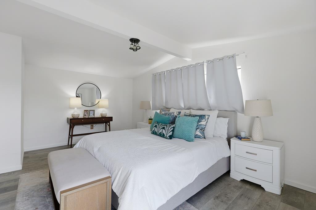 2675 Leeward Street Hayward, CA 94545 - Photo 26 of 75 a bedroom with a bed a table and painting on the wall