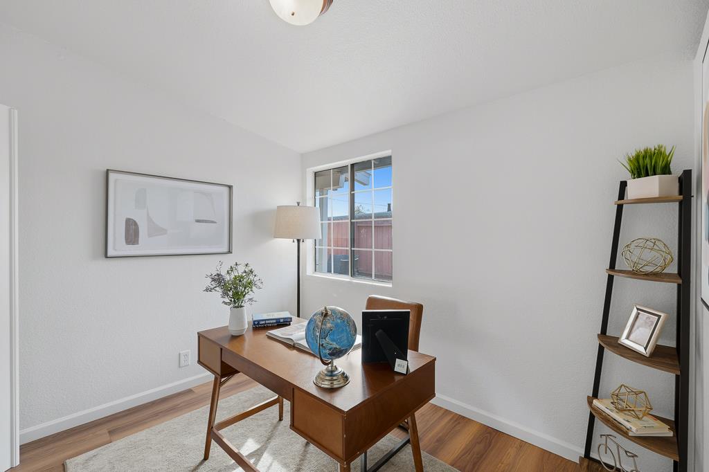 2675 Leeward Street Hayward, CA 94545 - Photo 32 of 75 a view of a workspace with furniture and wooden floor