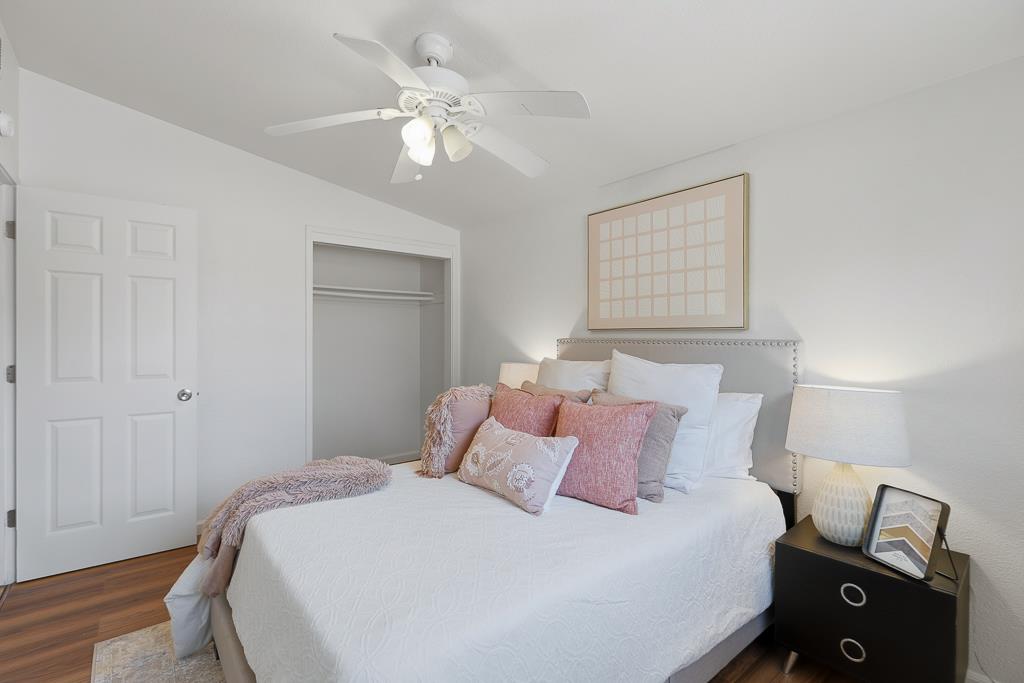 2675 Leeward Street Hayward, CA 94545 - Photo 37 of 75 a bedroom with a bed and a chandelier