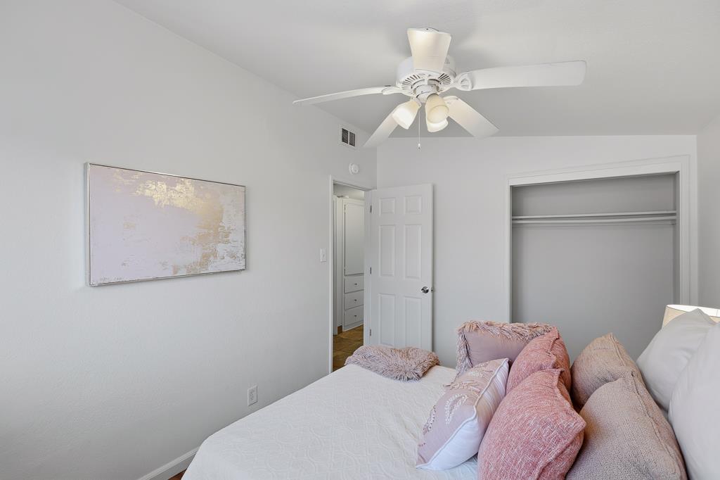 2675 Leeward Street Hayward, CA 94545 - Photo 38 of 75 a bedroom with a bed and a chandelier