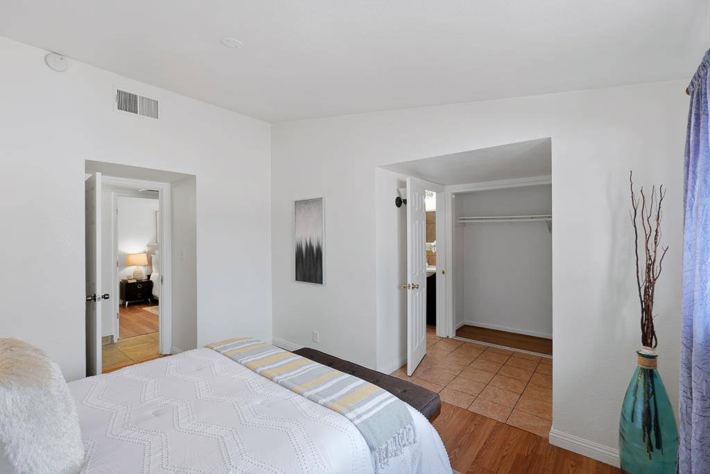 2675 Leeward Street Hayward, CA 94545 - Photo 45 of 75 a bedroom with a bed and a potted plant