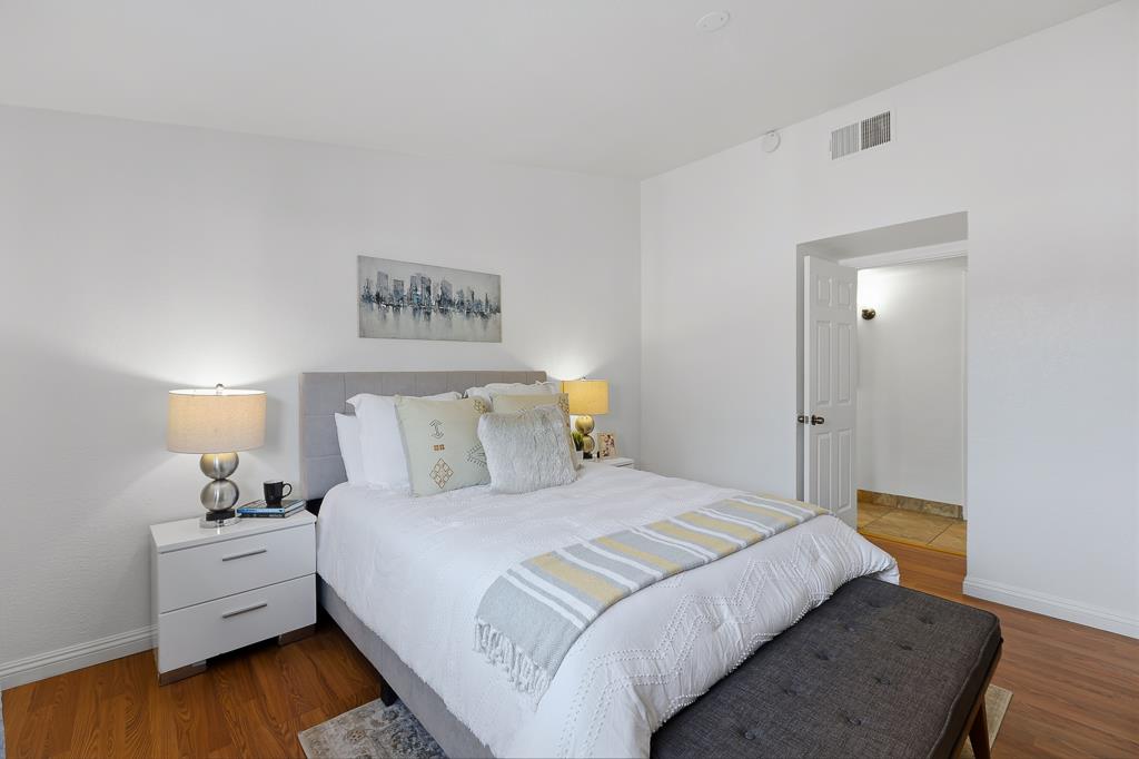 2675 Leeward Street Hayward, CA 94545 - Photo 46 of 75 a bedroom with a bed and a night stand
