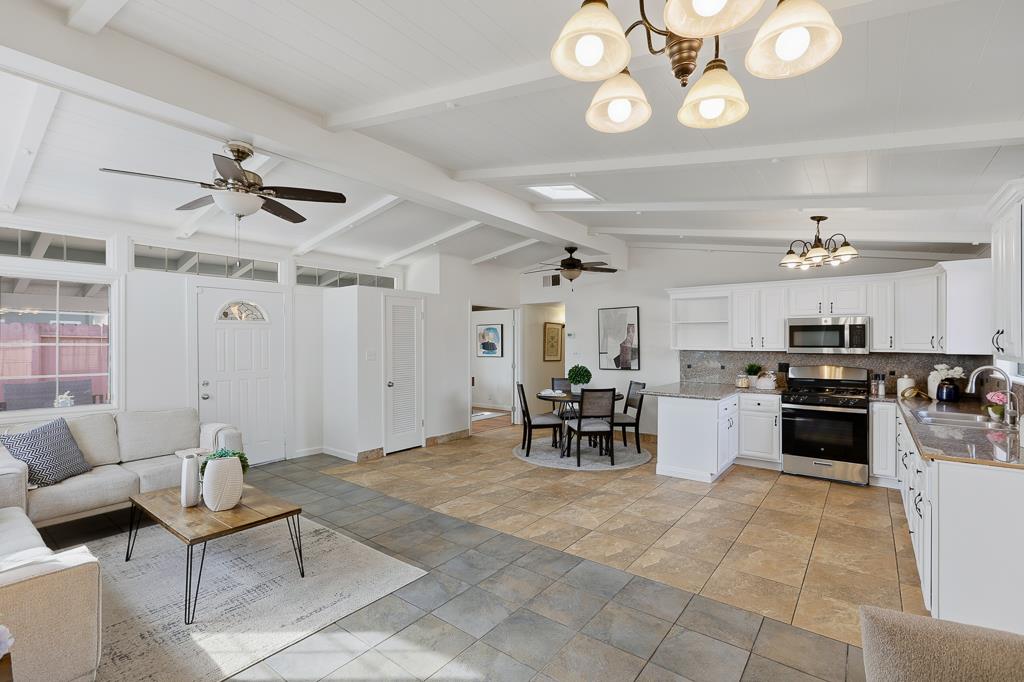2675 Leeward Street Hayward, CA 94545 - Photo 5 of 75 a living room with furniture kitchen view and a chandelier