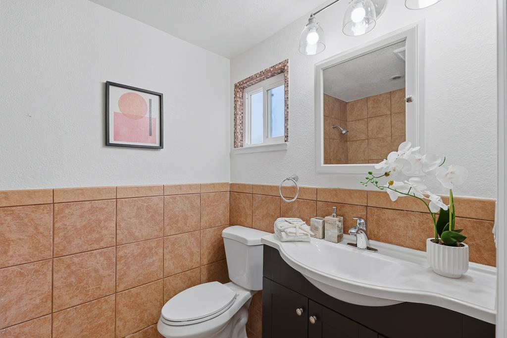2675 Leeward Street Hayward, CA 94545 - Photo 51 of 75 a bathroom with a sink mirror and toilet