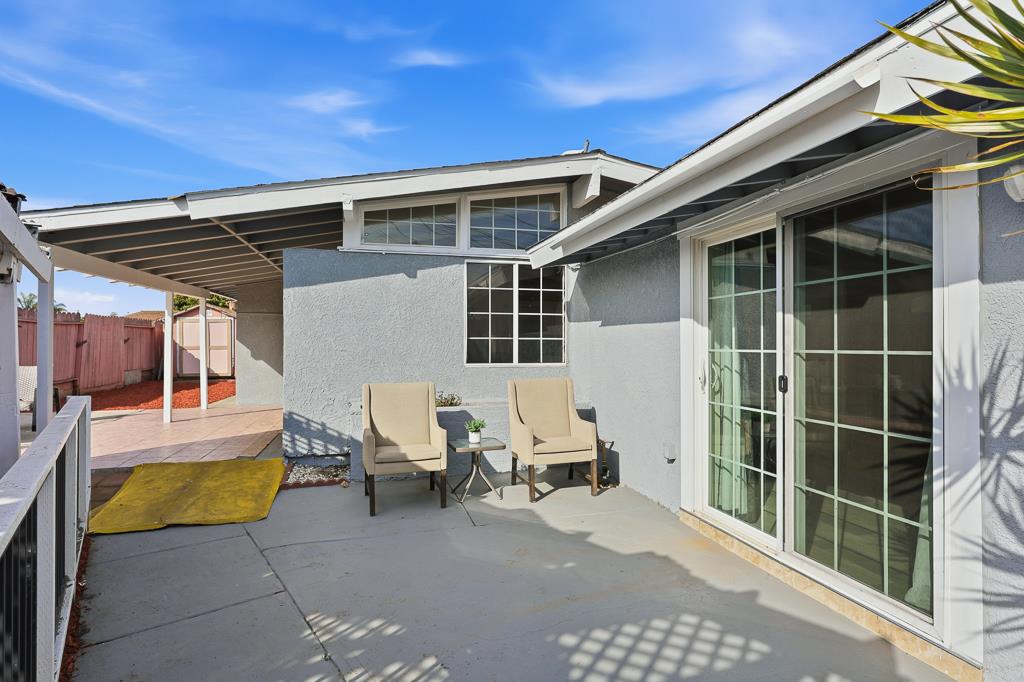 2675 Leeward Street Hayward, CA 94545 - Photo 55 of 75 a view of a patio with a table and chairs and wooden fence