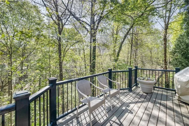 a view of a yard with an outdoor space and deck