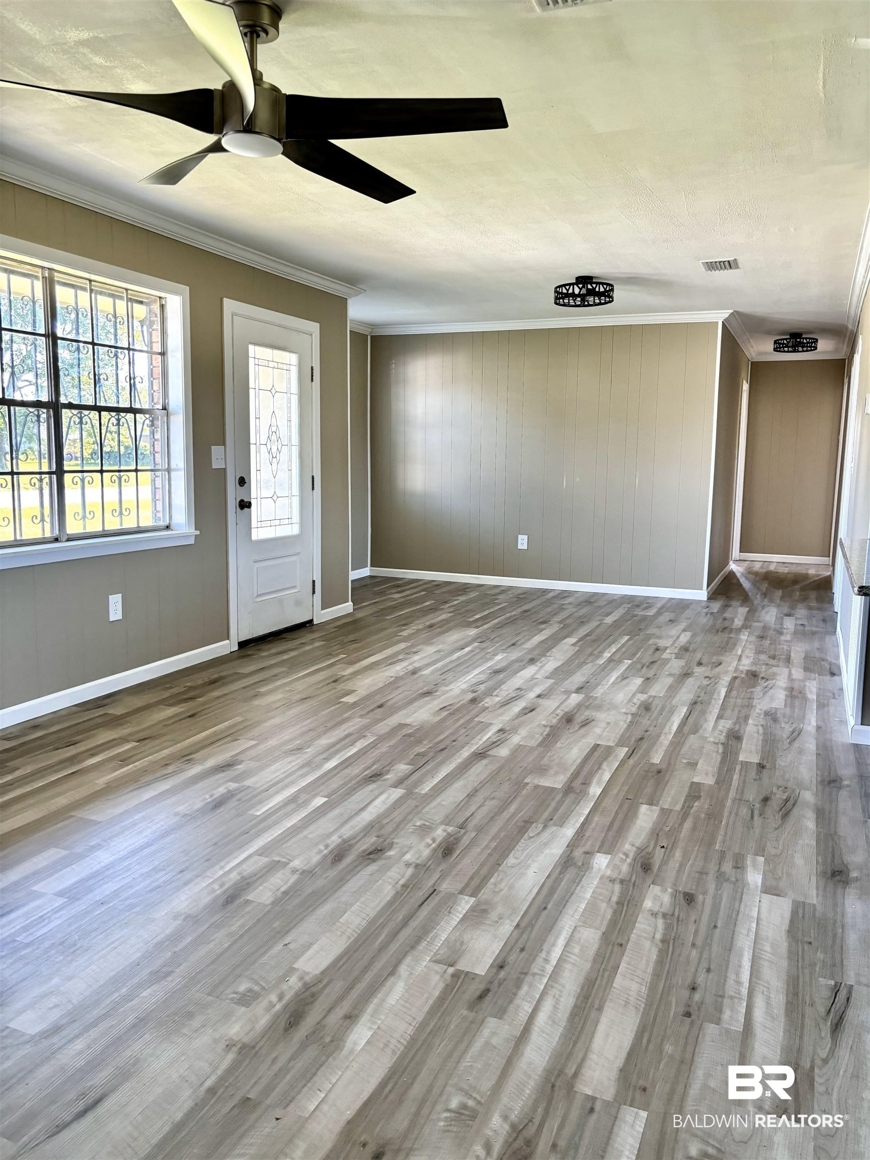 508 Freemanville Drive Atmore, AL 36502 - Photo 10 of 27 Entrance foyer with ornamental molding, ceiling fan, and hardwood / wood-style floors