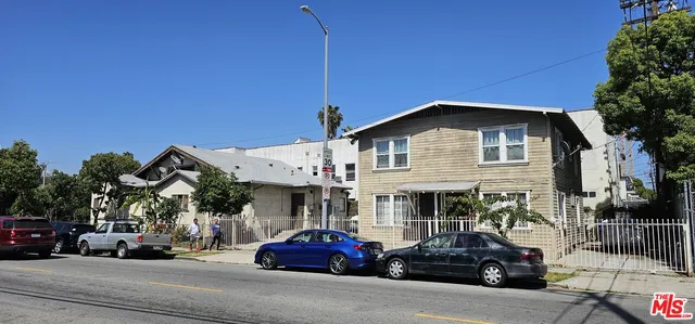 a view of a car parked in front of a building