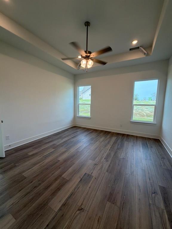 906 Perrin Lane Van Alstyne, TX 75495 - Photo 10 of 14 wooden floor in an empty room with a window