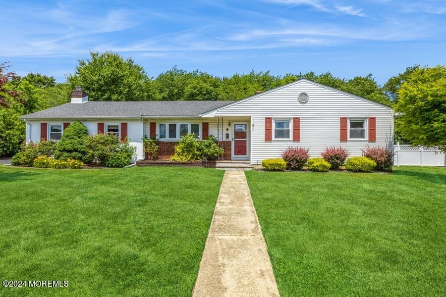 20 Westbrook Road Howell, NJ 07731 - Photo 1 of 6 a front view of house with yard and green space