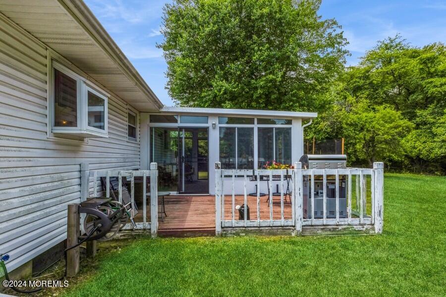 20 Westbrook Road Howell, NJ 07731 - Photo 5 of 6 a view of a house with a deck and a yard