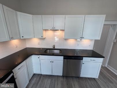 37 Bridge Street, Unit 501 Phoenixville, PA 19460 - Photo 13 of 38 a kitchen with granite countertop white cabinets and white appliances