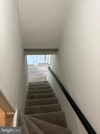 a view of hallway with wooden floor
