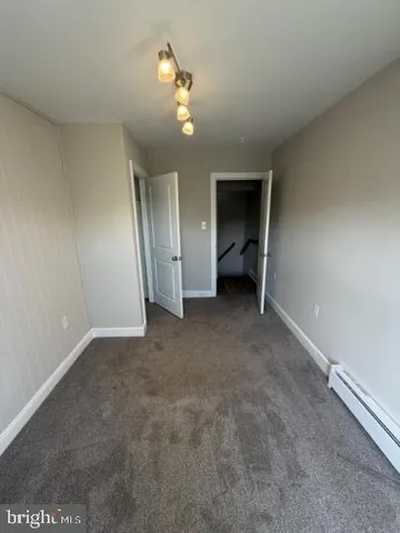 an empty room with a bathroom