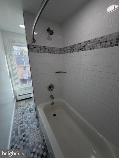 37 Bridge Street, Unit 501 Phoenixville, PA 19460 - Photo 23 of 38 a bathroom with a tub a rug and a shower