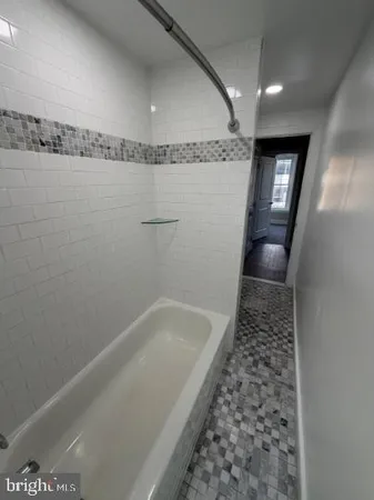 an empty room with windows and entrance