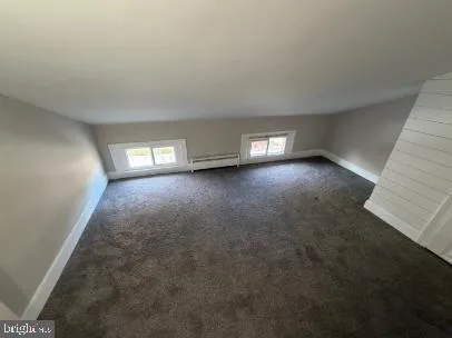 an empty room with wooden door