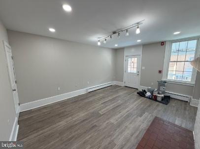 37 Bridge Street, Unit 501 Phoenixville, PA 19460 - Photo 9 of 38 an empty room with wooden floor and windows