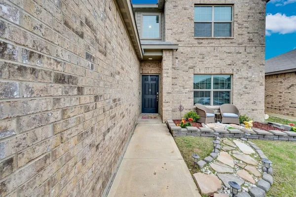 a big house with a yard and deck