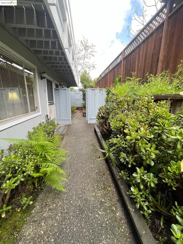 a backyard of a house with a garden