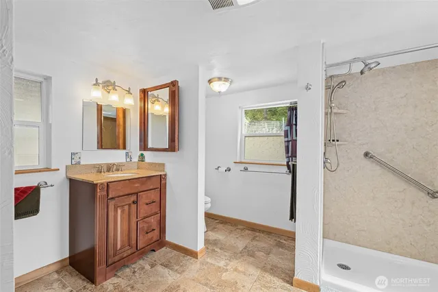a utility room with sink dryer and washer
