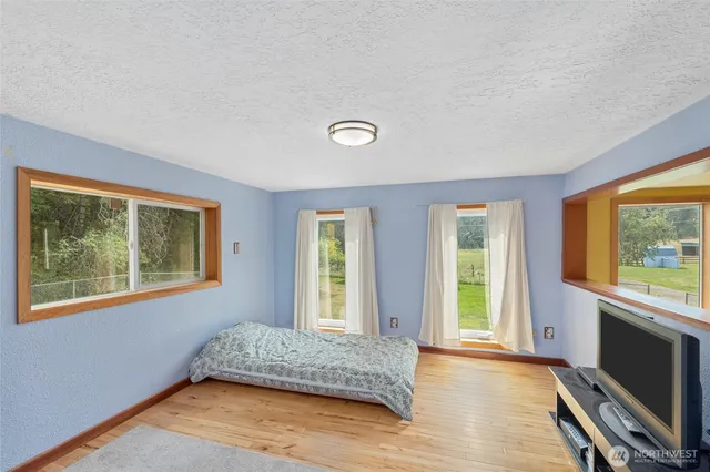 a bathroom with a shower and a glass door