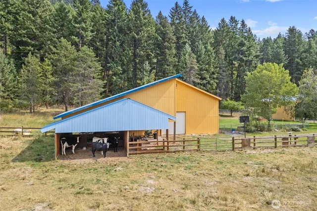 a view of an empty room with wooden walls