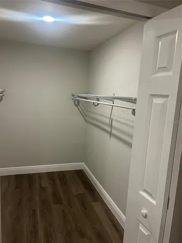 a view of a room with racks on the wall