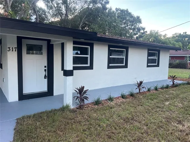 a backyard of a house with seating space