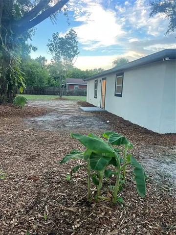 a backyard of a house with lots of green space